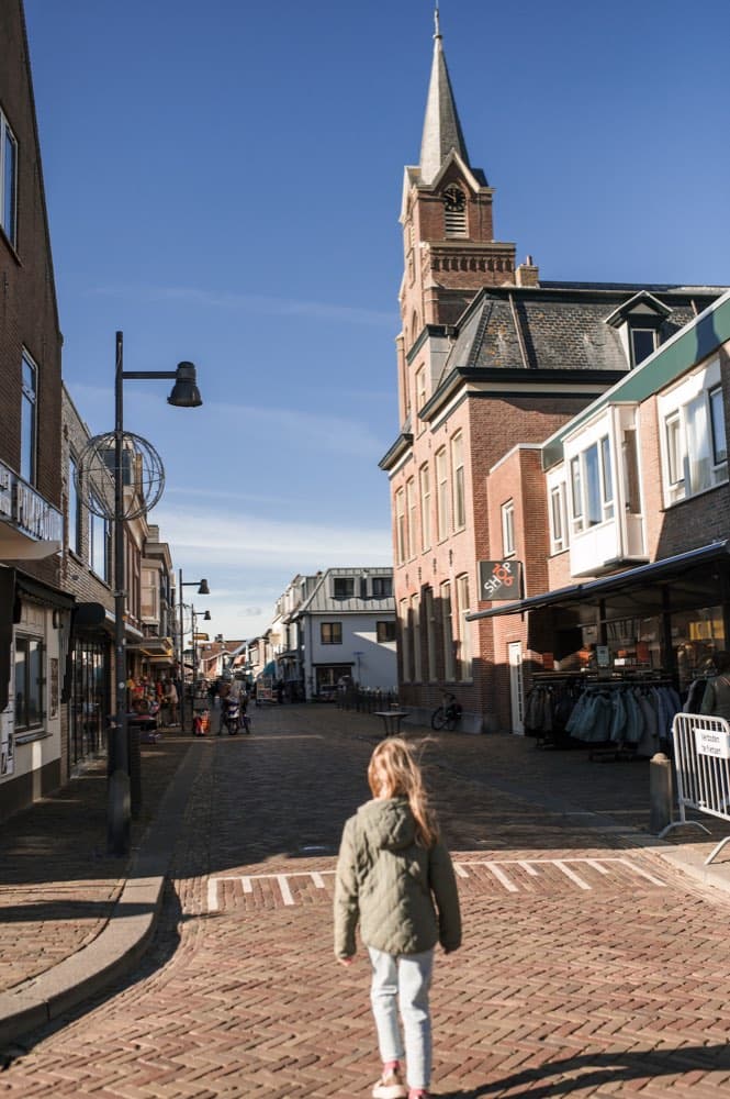 The Voorstraat, Egmond aan Zee's shopping street, with the church